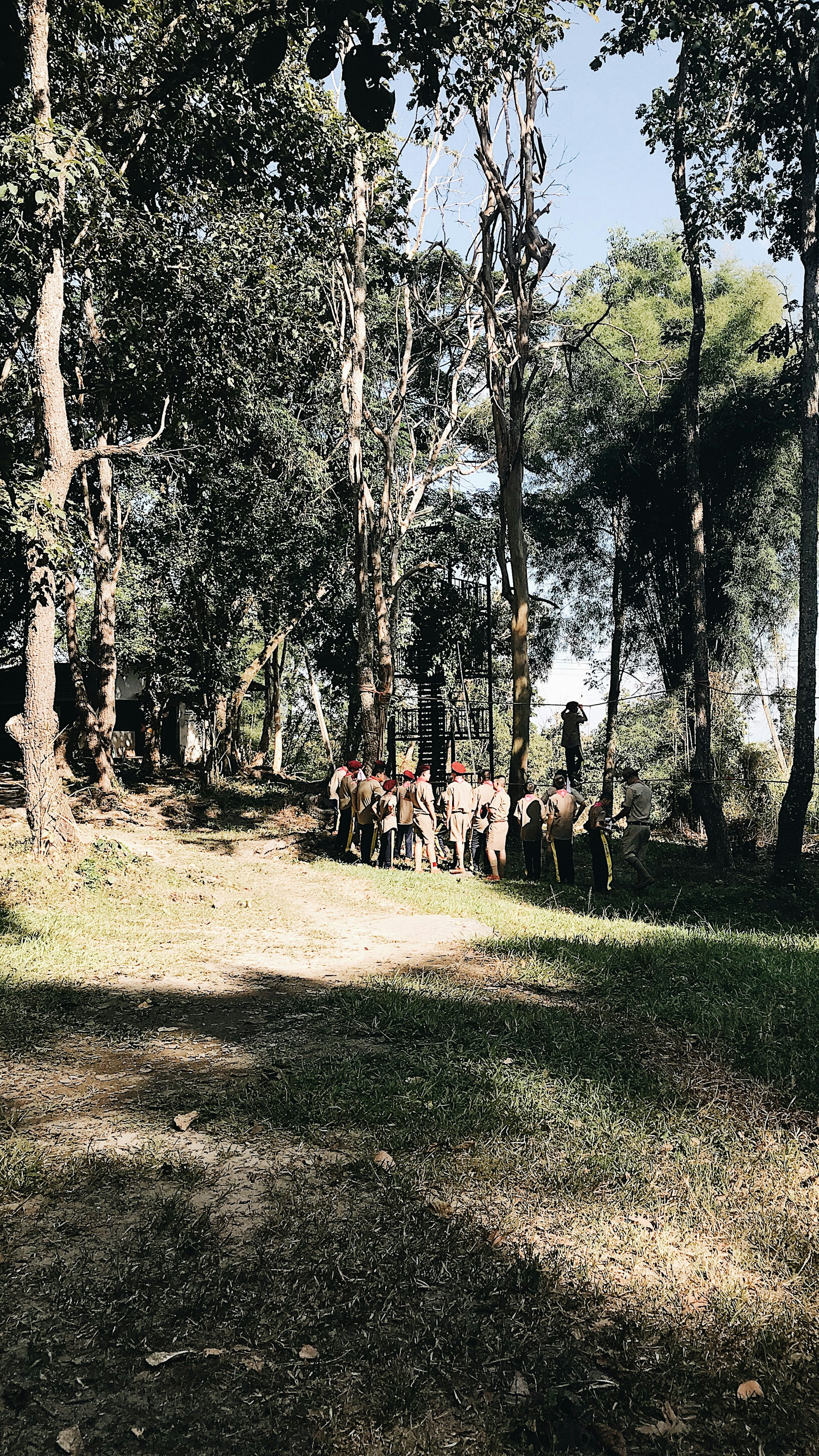 woman wearing yellow long-sleeved dress under white clouds and blue sky during daytime