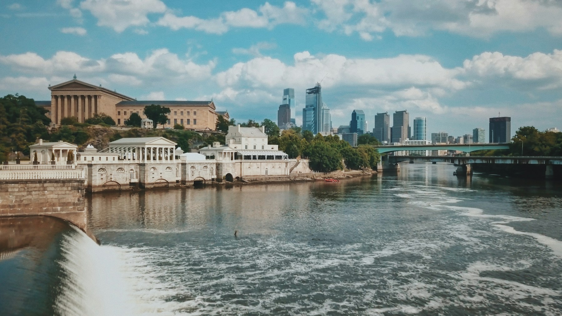 Schuylkill River and bridges with Philadelphia’s art museum and downtown skyline beyond.