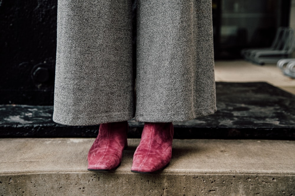 person wearing gray bell-bottom pants