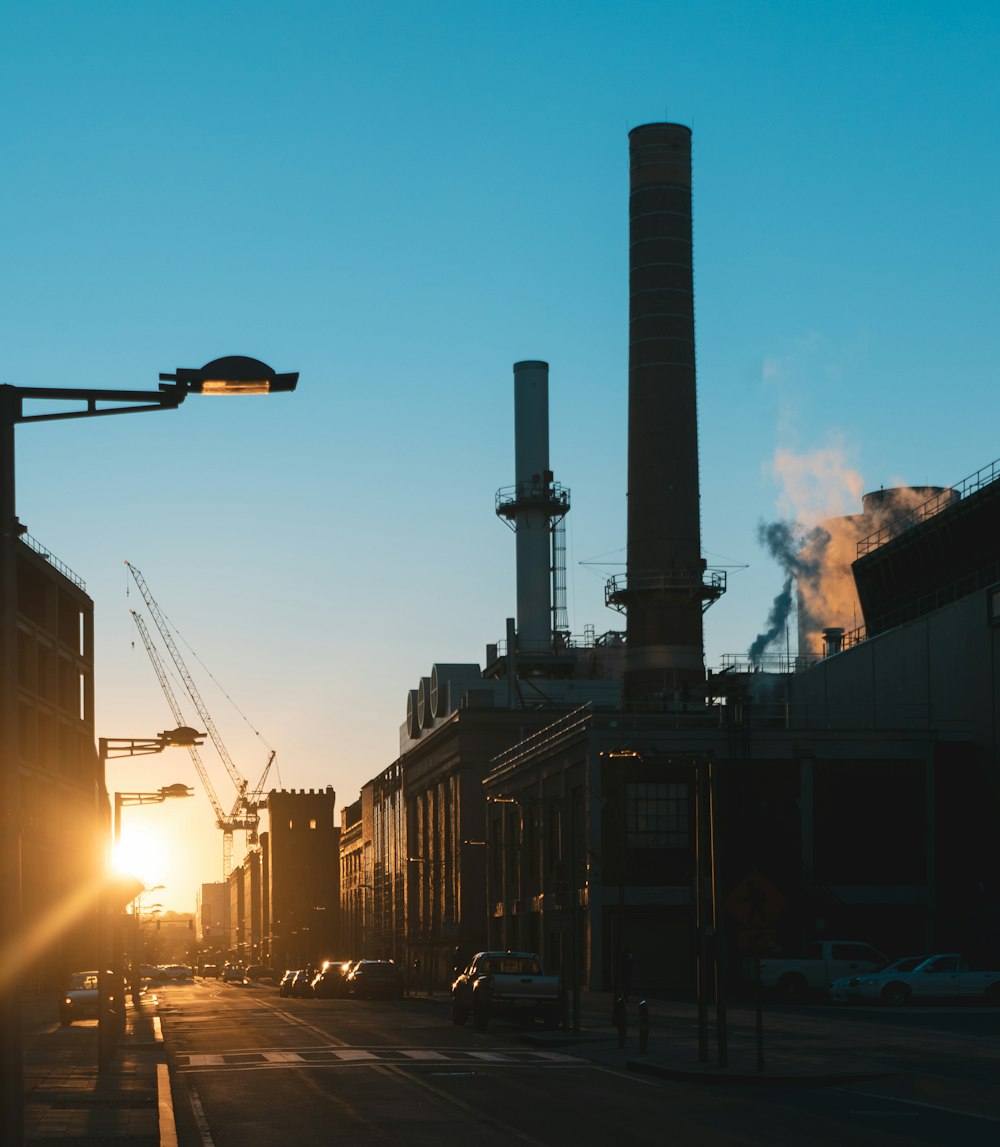 brown building with brick chimney during golden hour