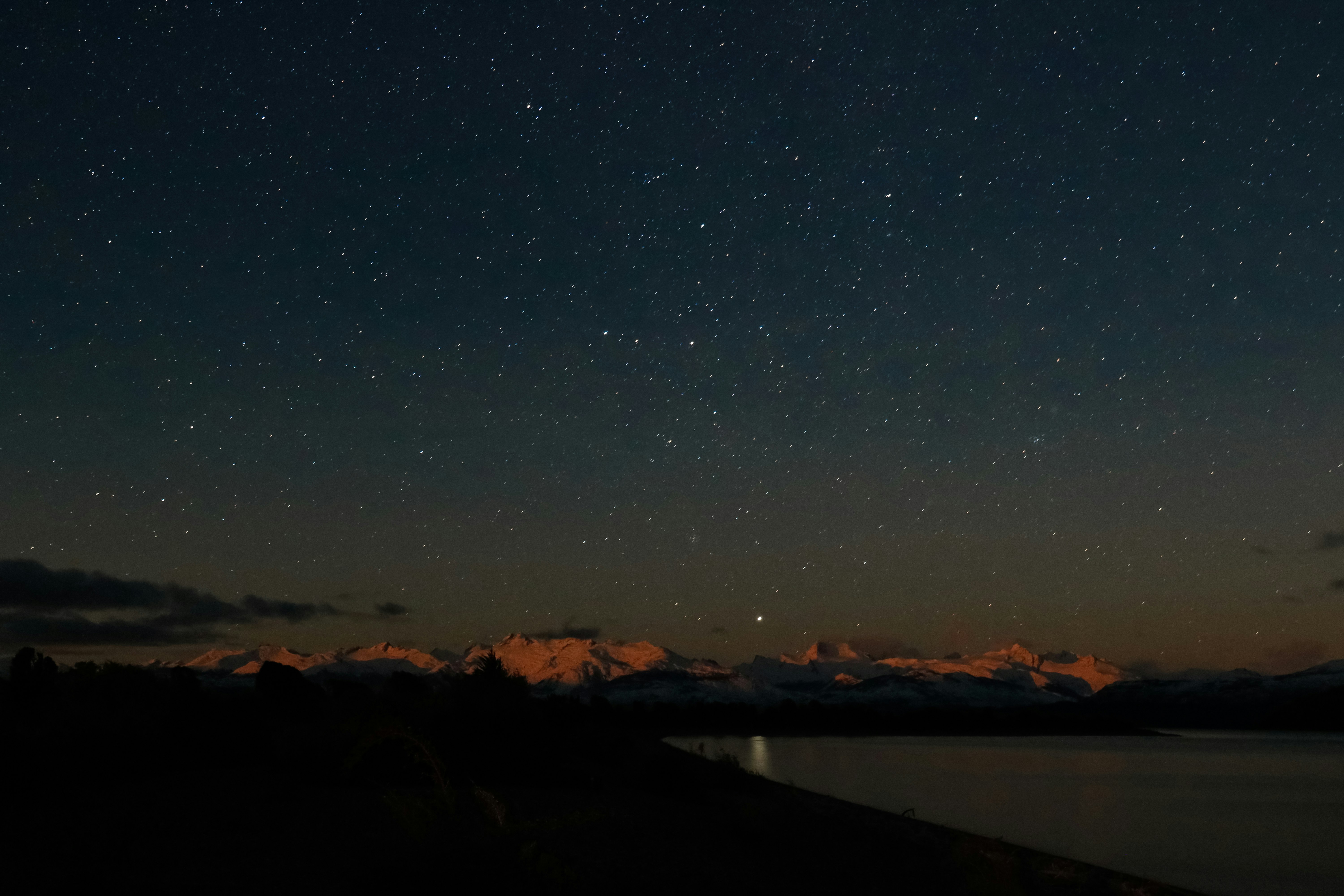 landscape photography of clear sky full of stars over mountains during night