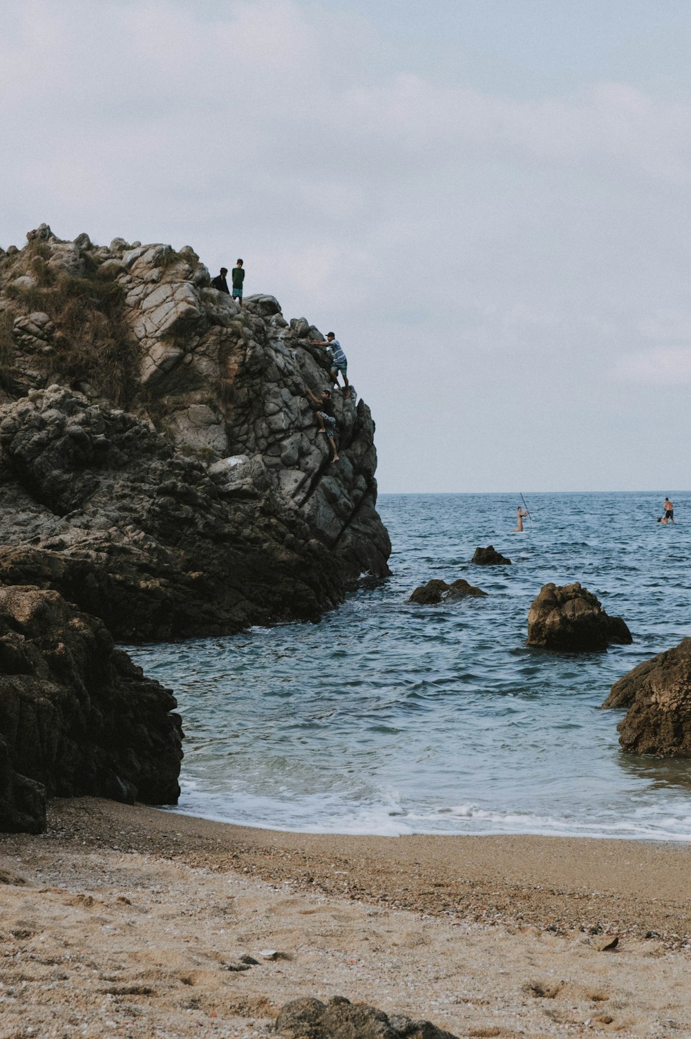 rock formations on seashore at dayttime