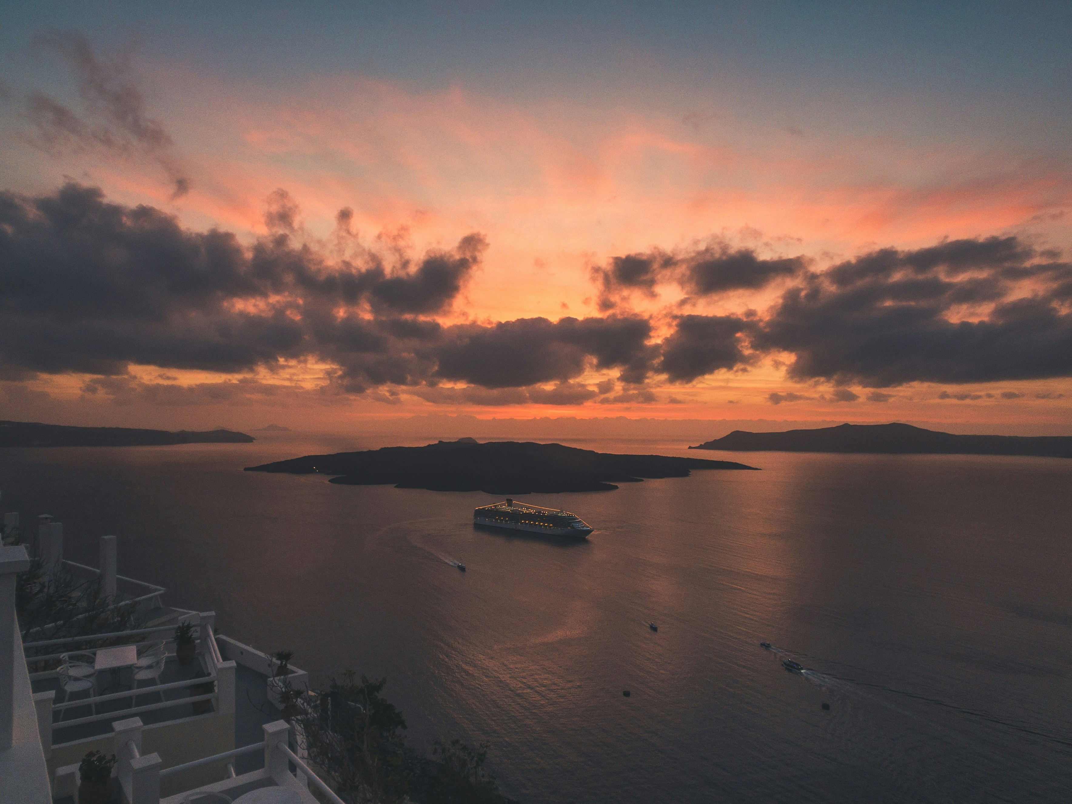 Santorini caldera sunset view with cruise ship