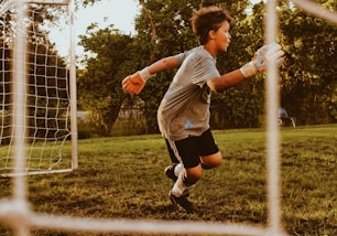 boy playing soccer