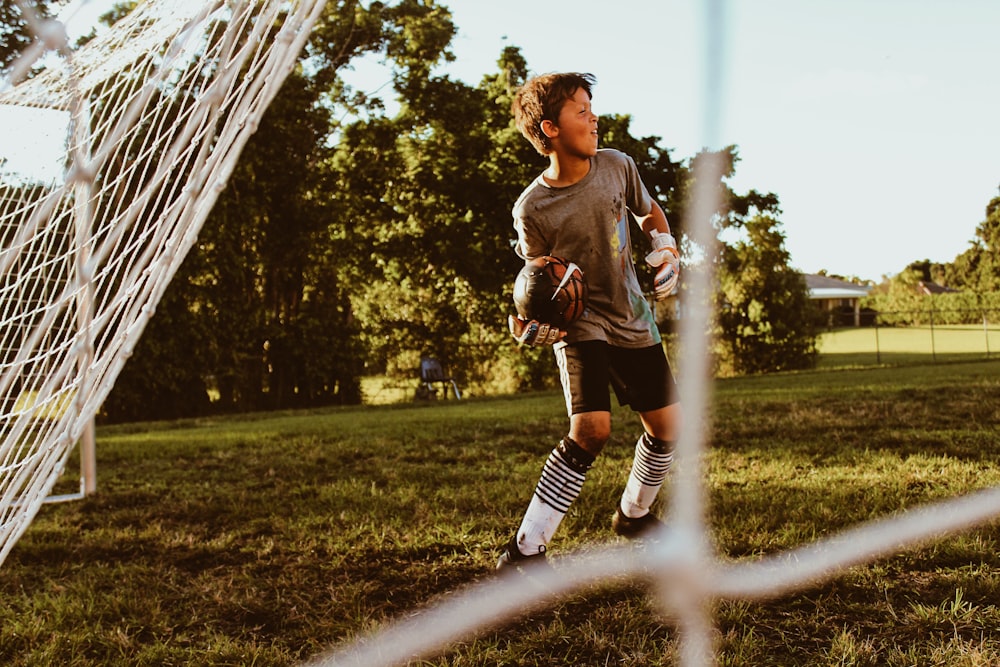 boy holding ball