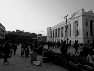 A bustling street scene with people and architecture.