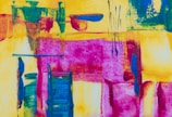 An abstract painting filled with bold colors and shapes.