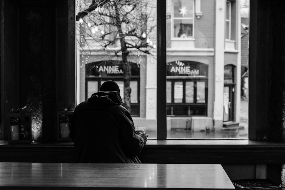 man sitting inside building during daytime