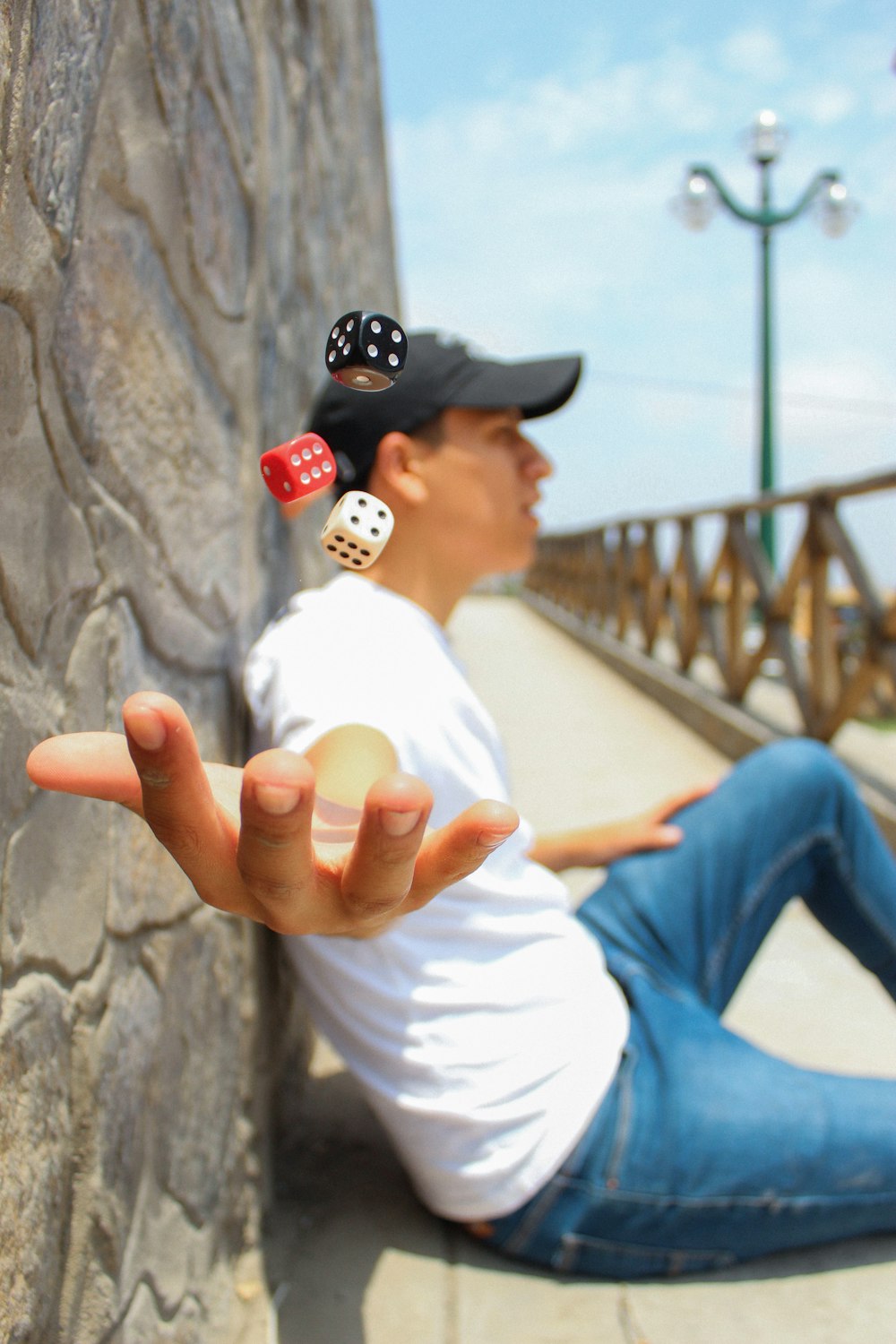 time-lapse photography of man throwing two dice