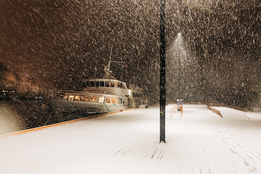 white boat beside port photo – Free Blizzard Image on Unsplash