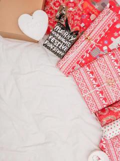 Festive gift wrap with family essentials items like lunch boxes and bamboo straws ready for Christmas.