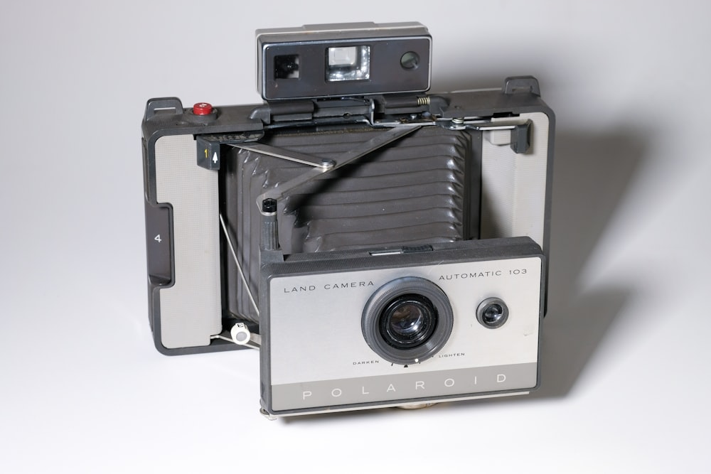 gray and black Polaroid land camera