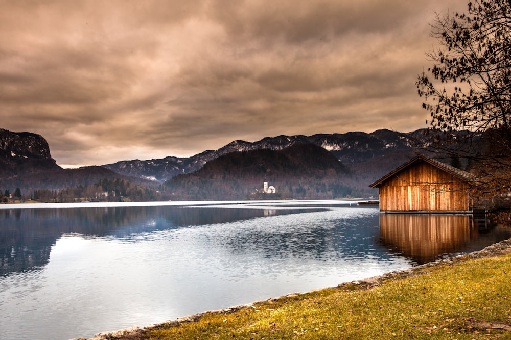 brown house on body of river