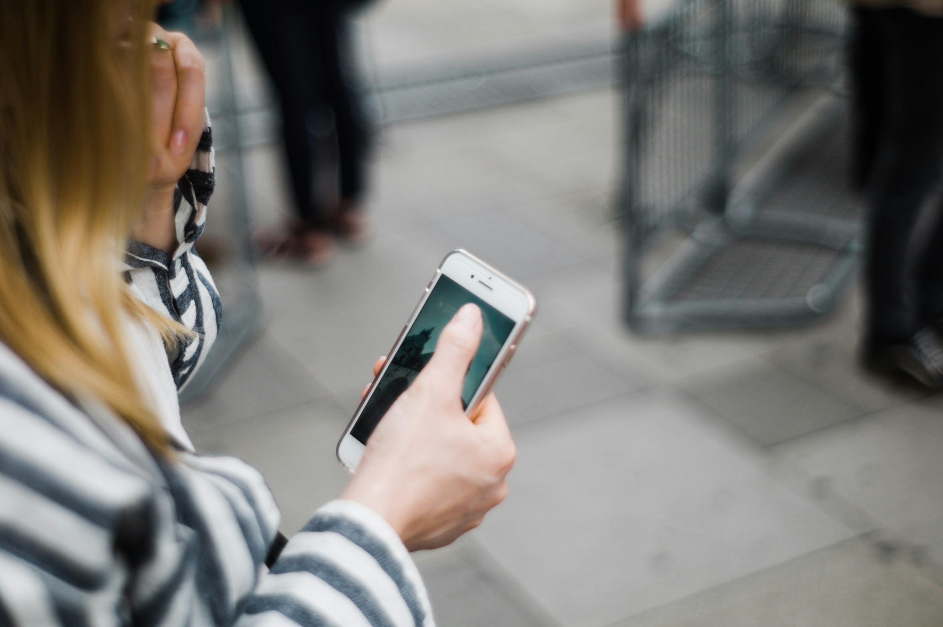 distressed person looking at unresponsive smartphone screen