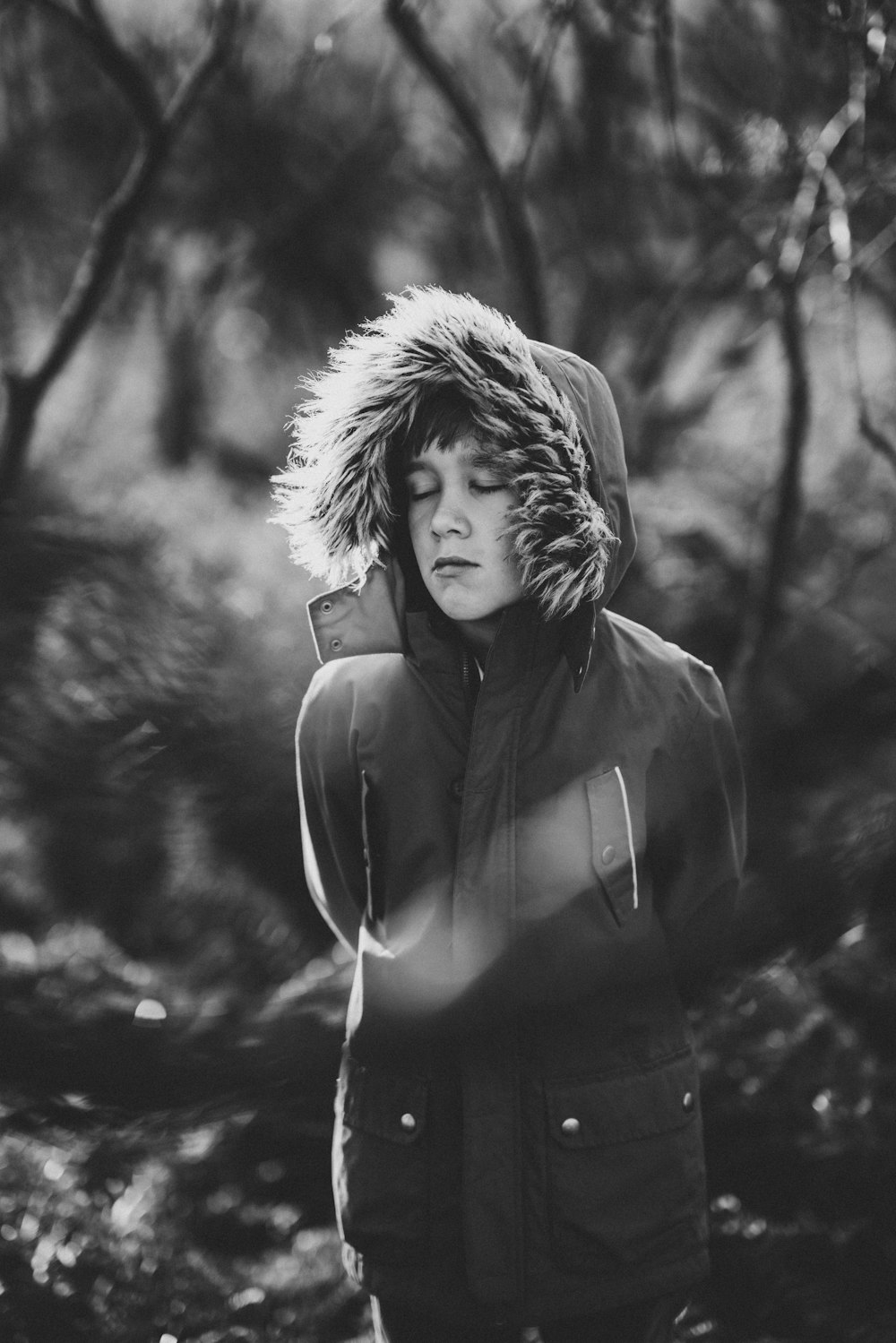 grayscale photography of person in forest