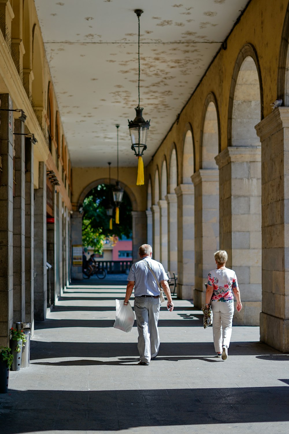 man and woman walking down the hallway