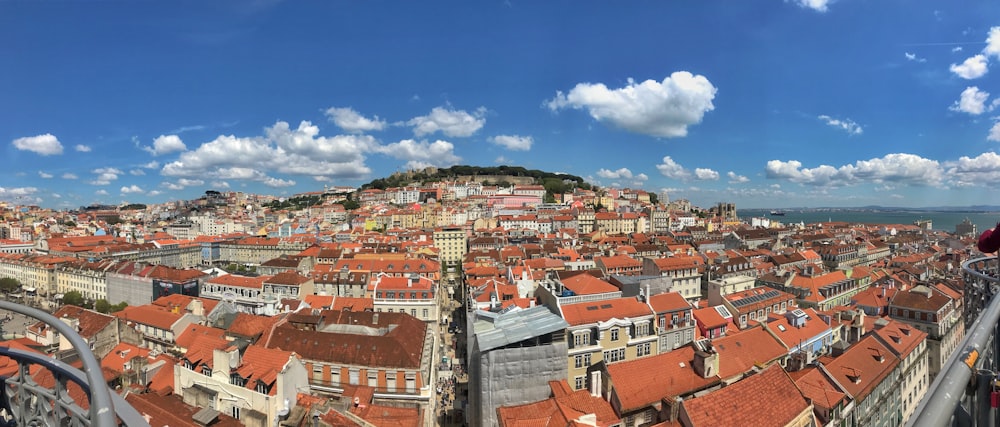 panoramic photography of village under cumulus clouds