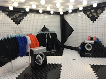 Crisp wash-and-wear fabric displayed in a modern black and white setting.