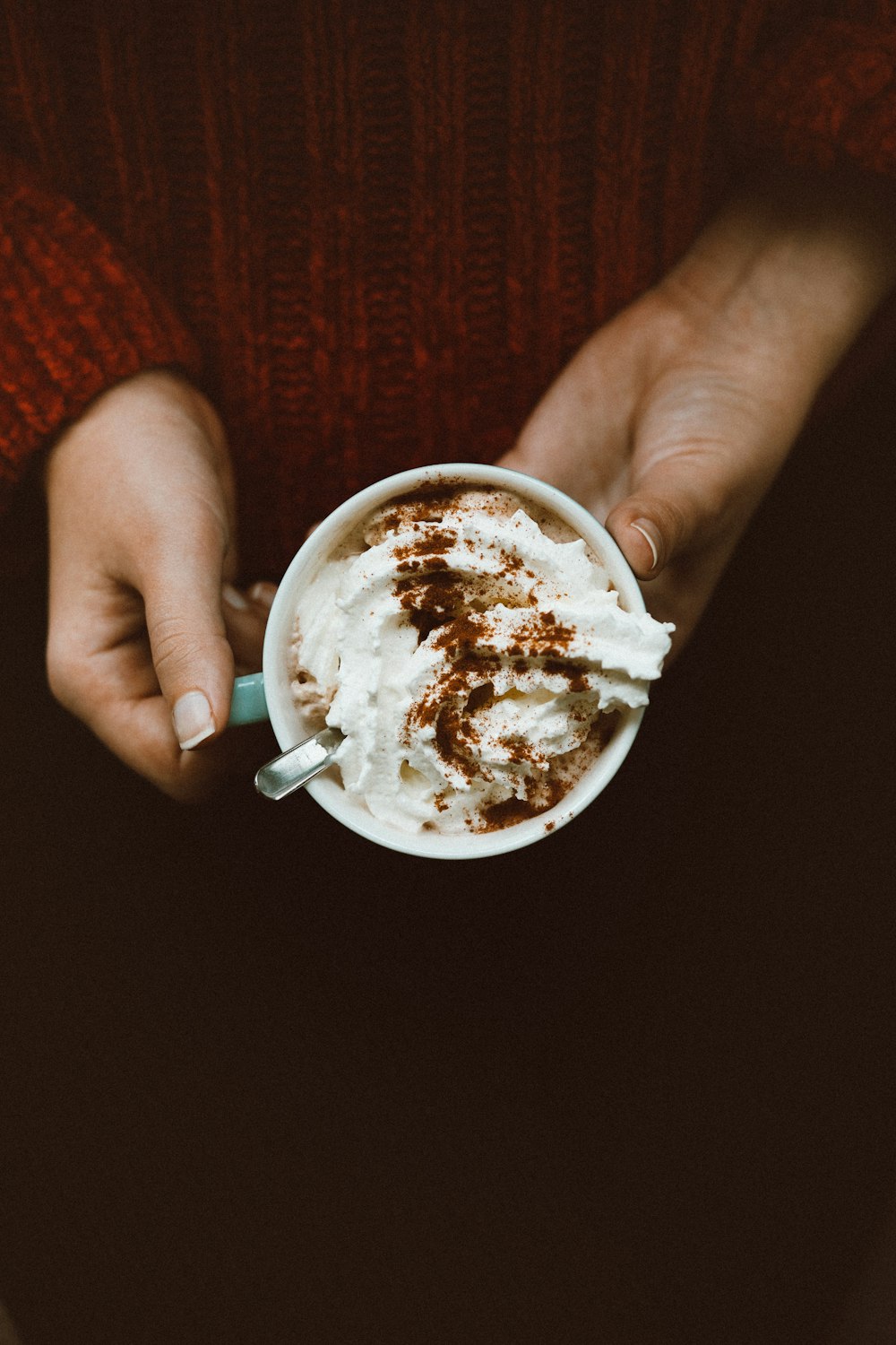 person holding cup of ice cream