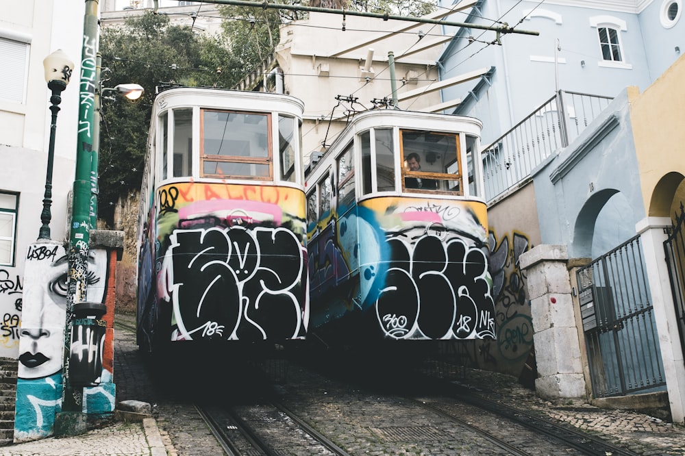 2 multicolored trams