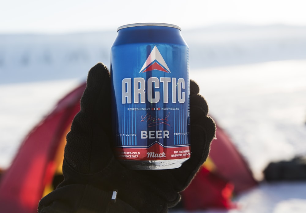 person holding Arctic Beer can