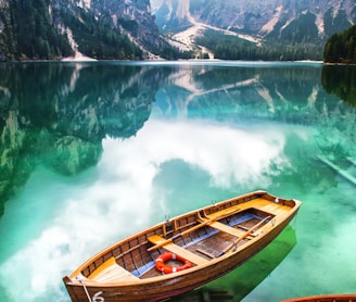 brown gondola on body of water