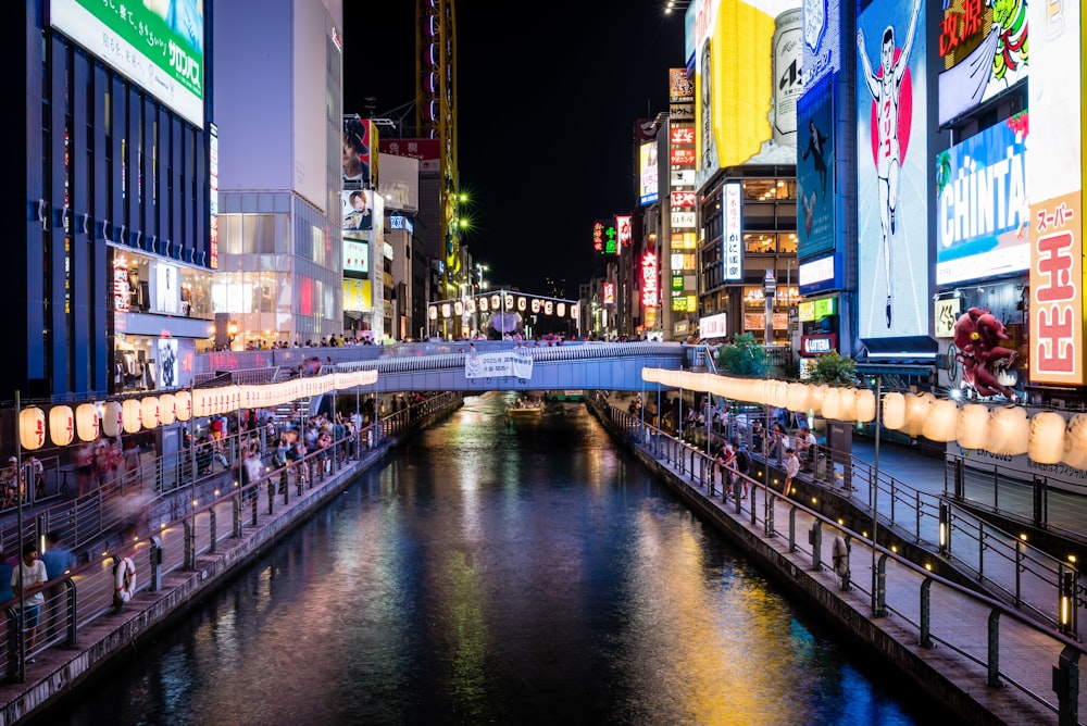 people in both banks of river at night