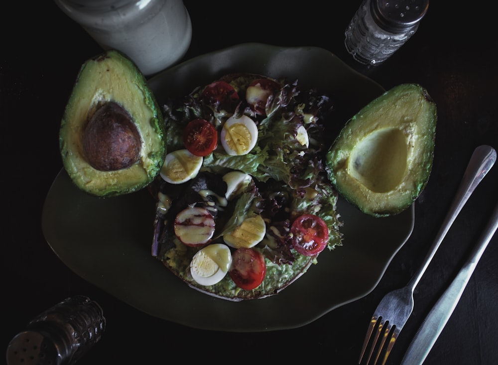 sliced avocado fruit and salad with eggs