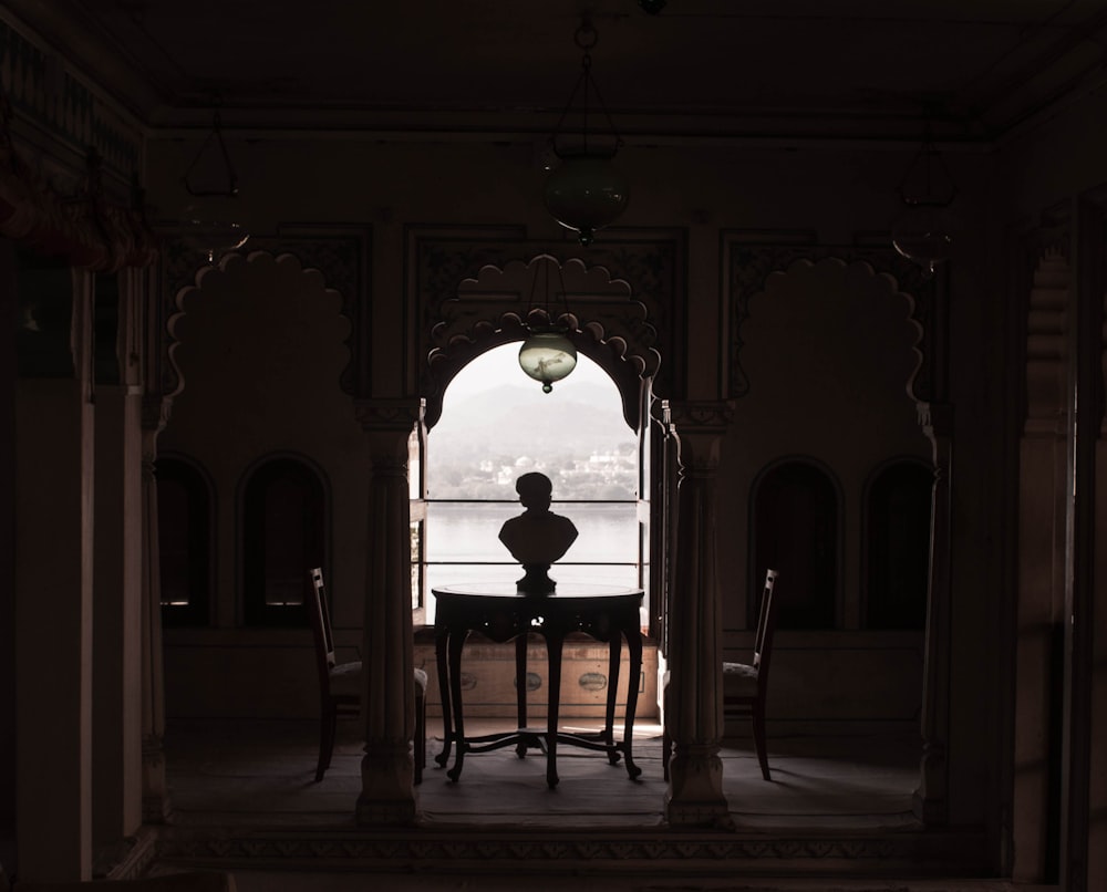 round table near the window during daytime