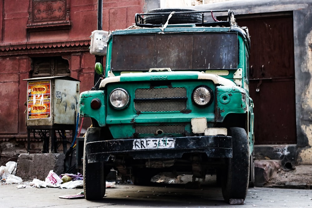 parked green off road vehicle