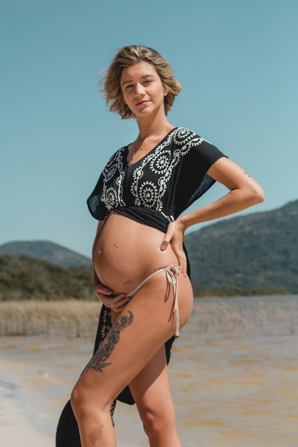 pregnant woman touching her tummy