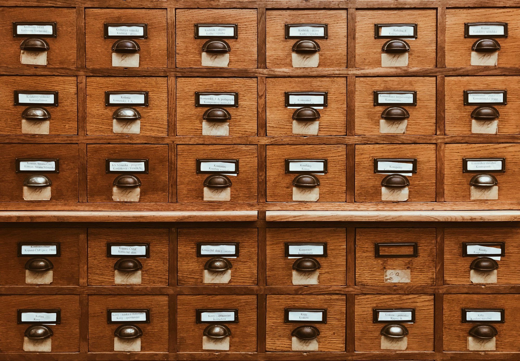 picture of an old card catalog wooden filing cabinet