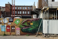 A mural depicting urban life, infused with Chambeh's artistic flair.
