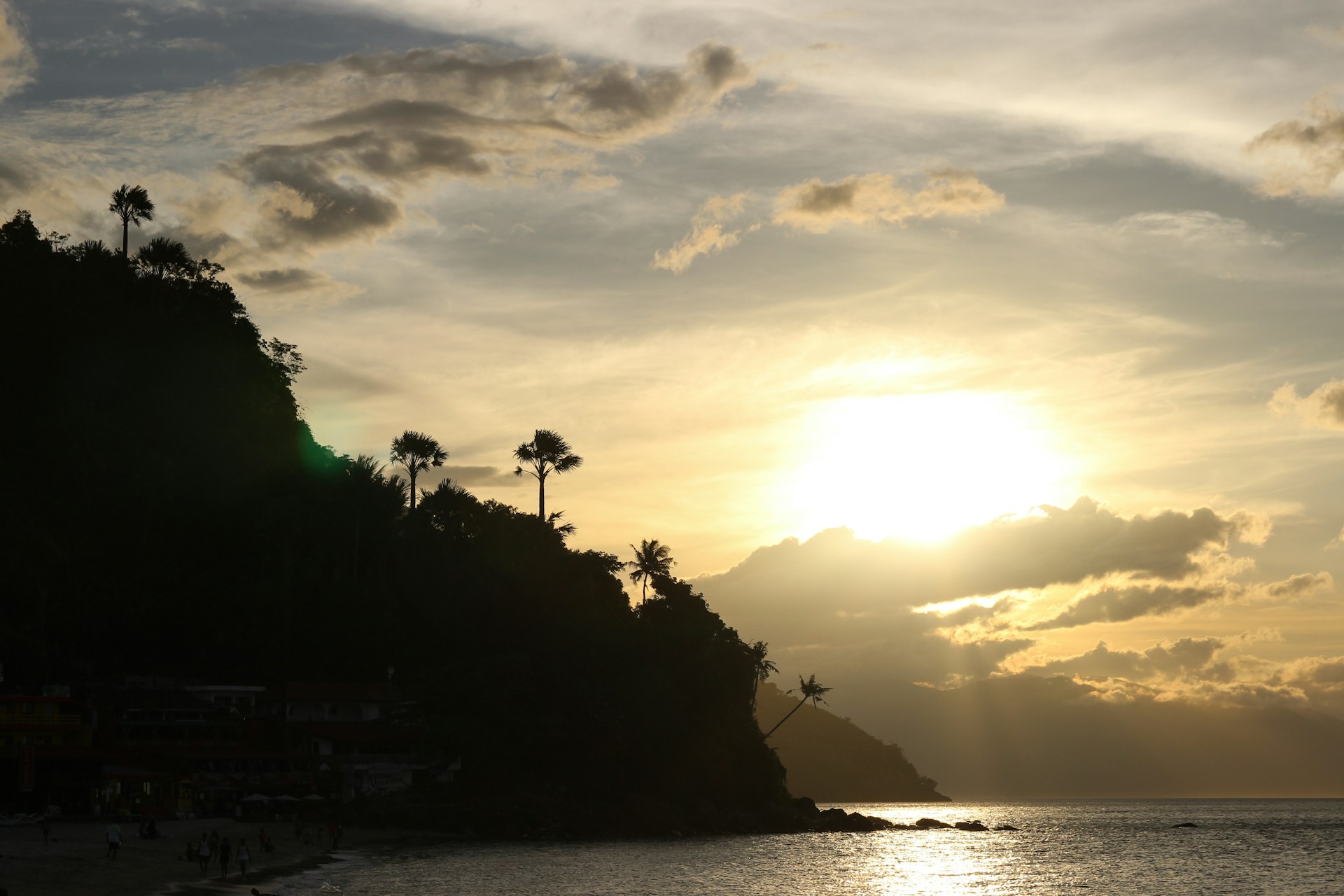 woman wearing yellow long-sleeved dress under white clouds and blue sky during daytime