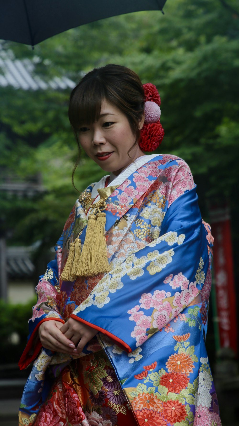smiling woman wearing floral kimono