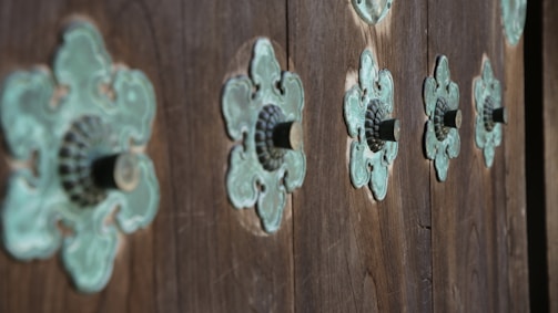 Custom-made metal studs lined up for quality check.