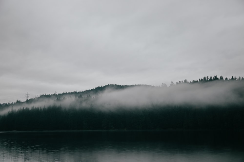 body of water under white cloudy sky