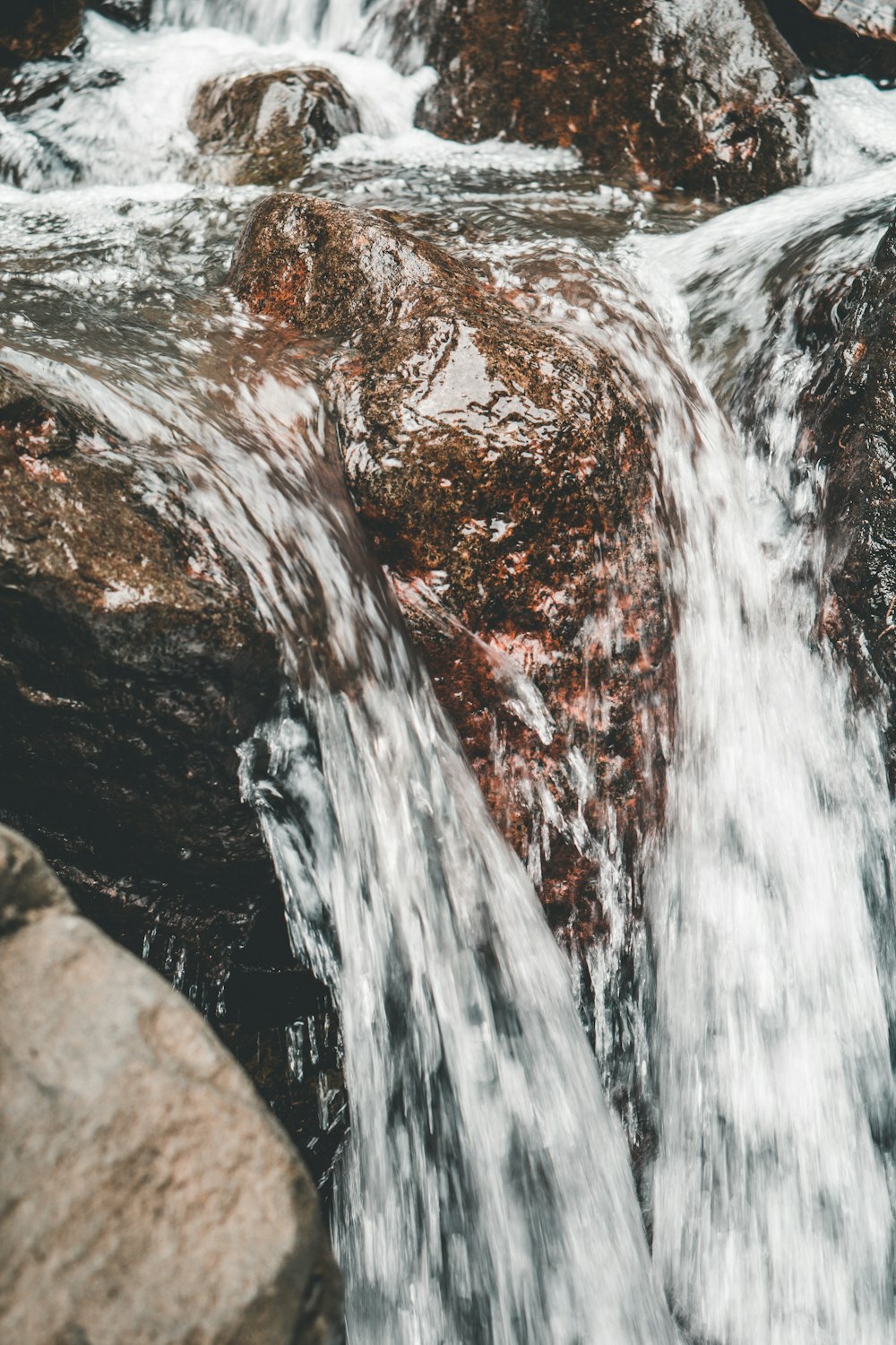 stream water and rocks close-up photo