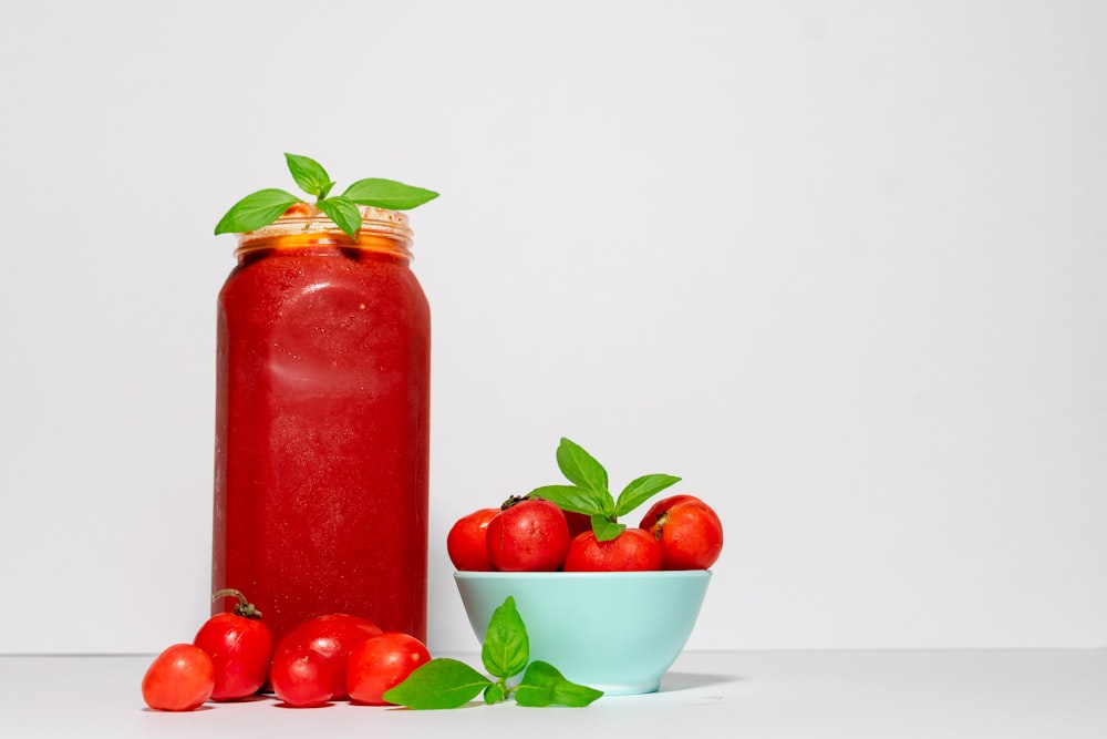 red tomato with jar