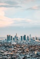 cityscape under white cloud and blue sky during datyiem