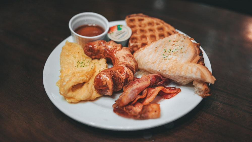 plated breakfast meal on brown wooden table