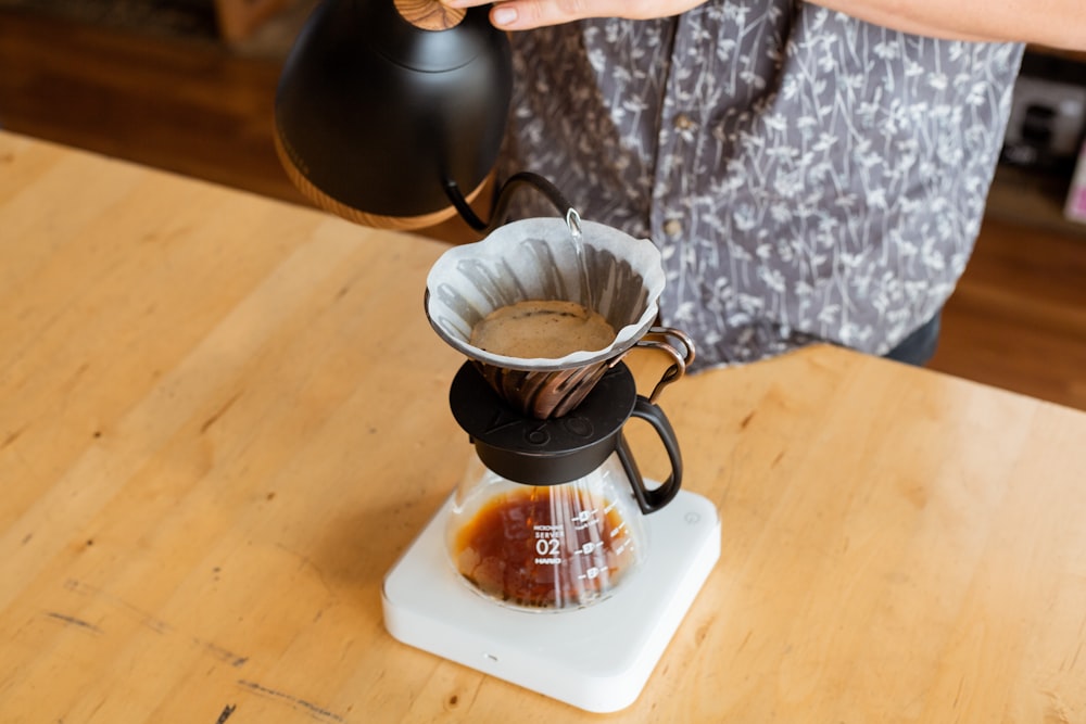 Clear pour-over coffee brewer with digital scale photo – Free Modern plant  Image on Unsplash