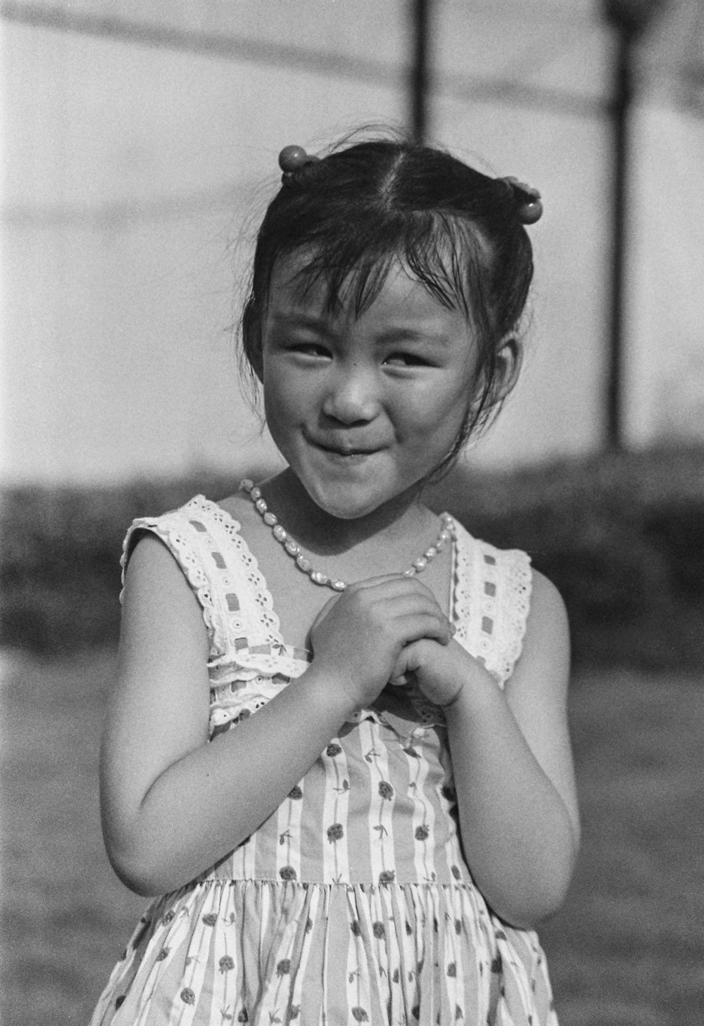 grayscale photography of smiling girl