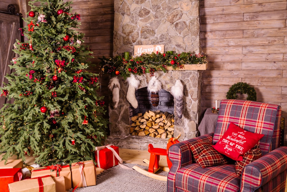 presents under Christmas tree near fireplace