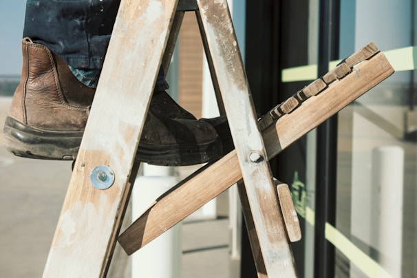 person standing on ladder