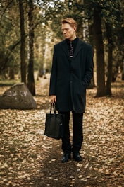 man waering blue trench coat