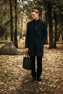 man waering blue trench coat