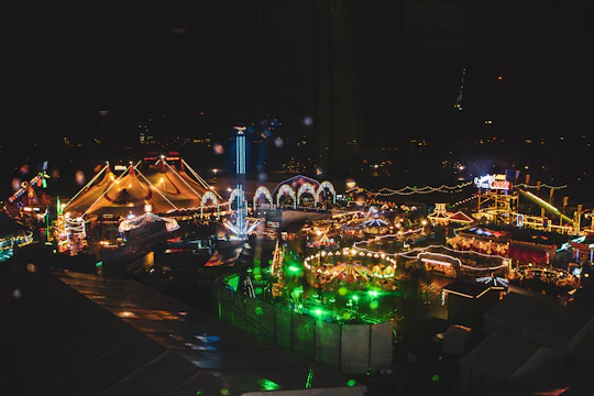A bustling entertainment complex filled with colorful lights and happy crowds.