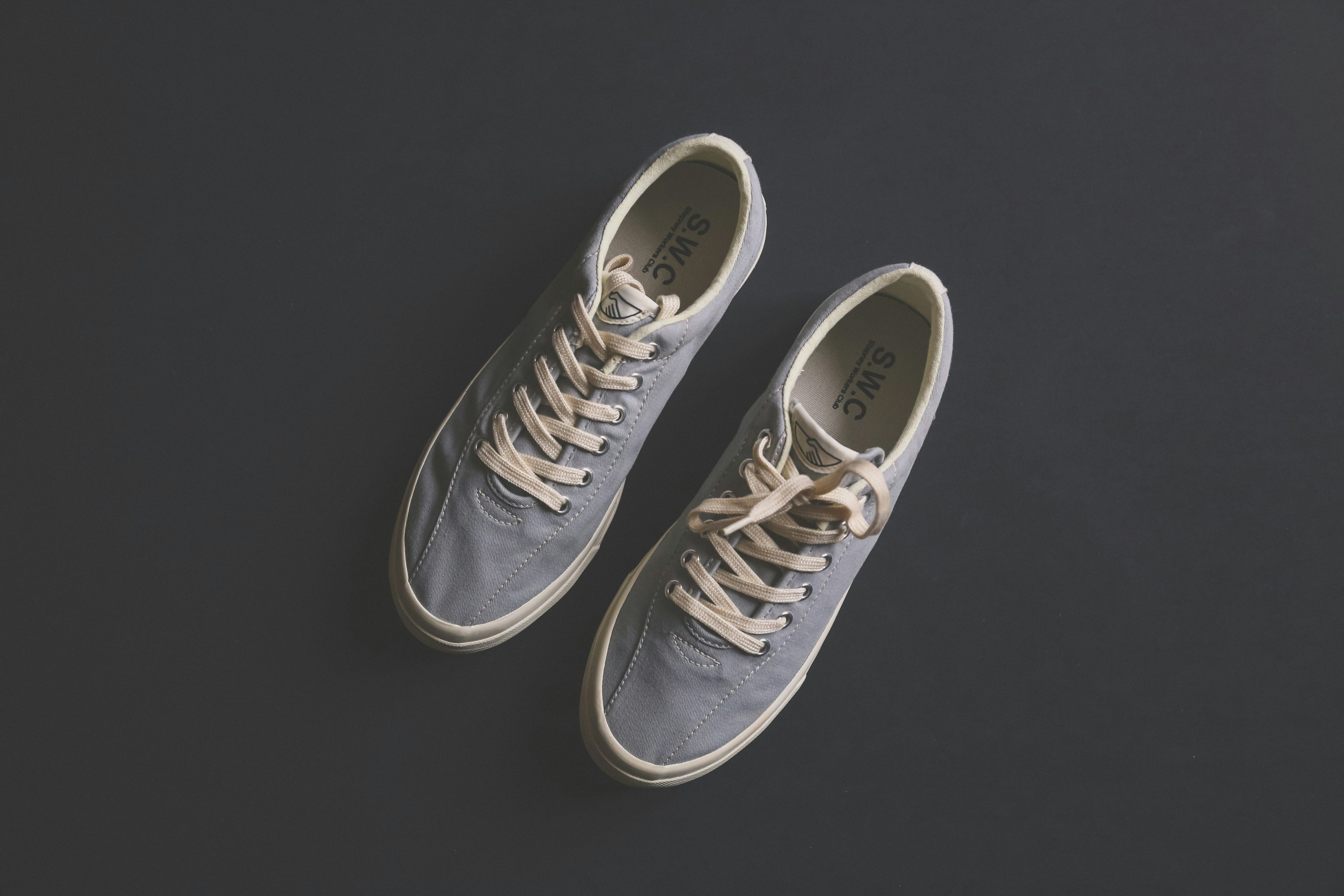 pair of gray SWC low-top sneakers