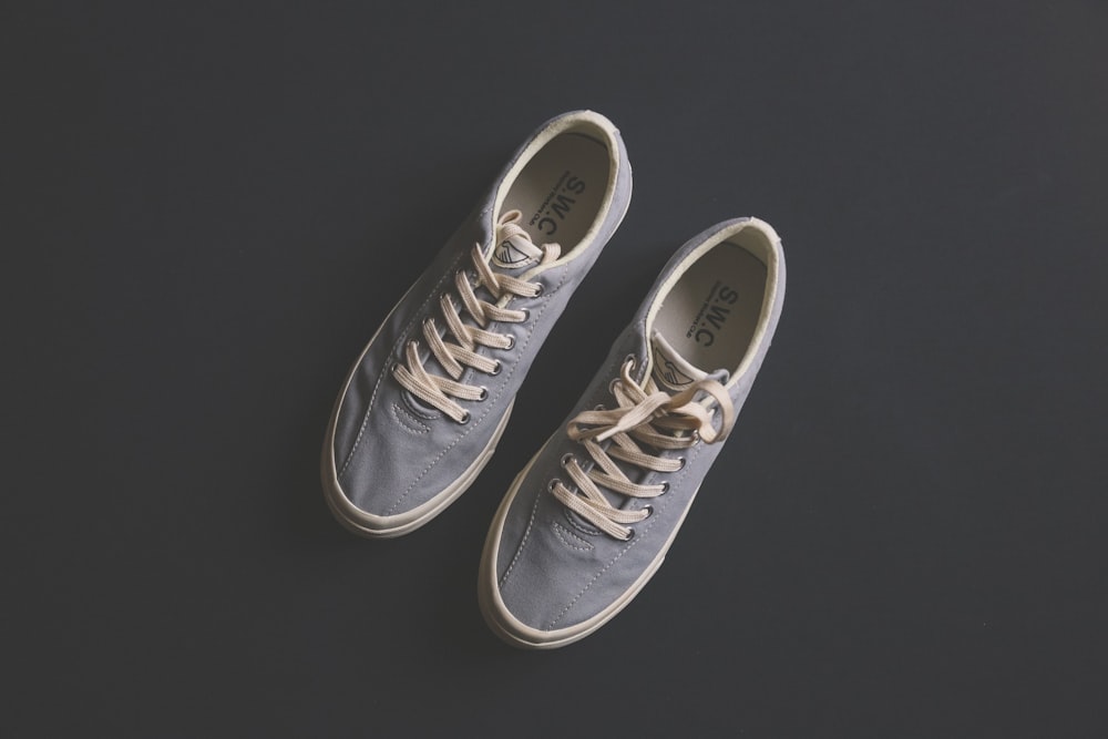 pair of gray SWC low-top sneakers